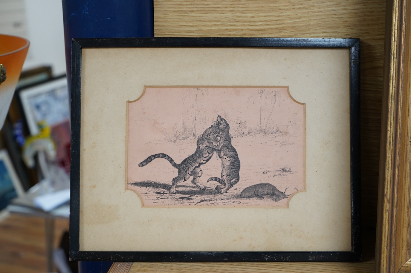 19th century School, pen and ink, Two tigers fighting over prey, monogrammed J.B., 12 x 17.5cm. Condition - poor to fair